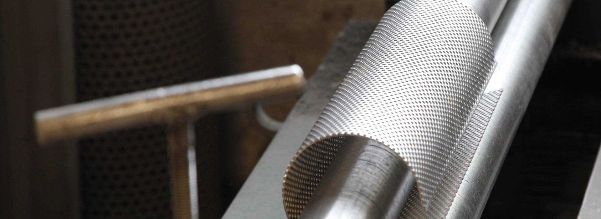 Wire mesh is rolled into a cylinder shape.