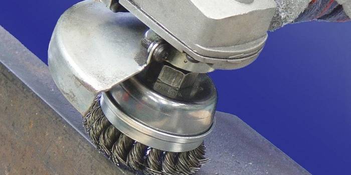 The machine is brushing the metal surface.