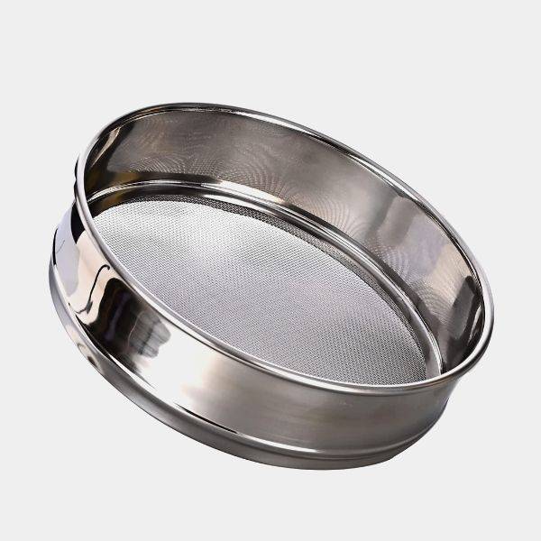 A stainless steel test sieve is displayed.
